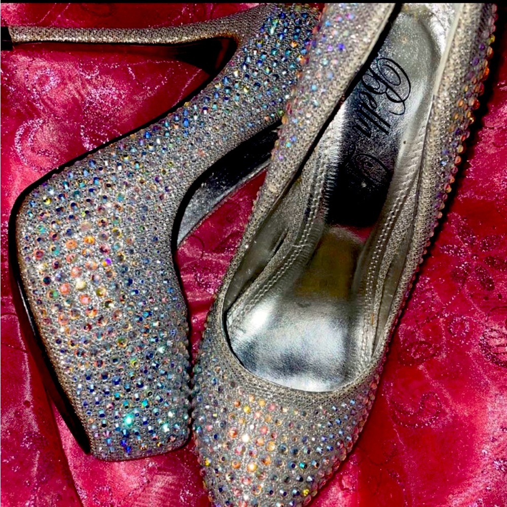 Silver heels, size 6.5 . Never worn . Just using space in my closet